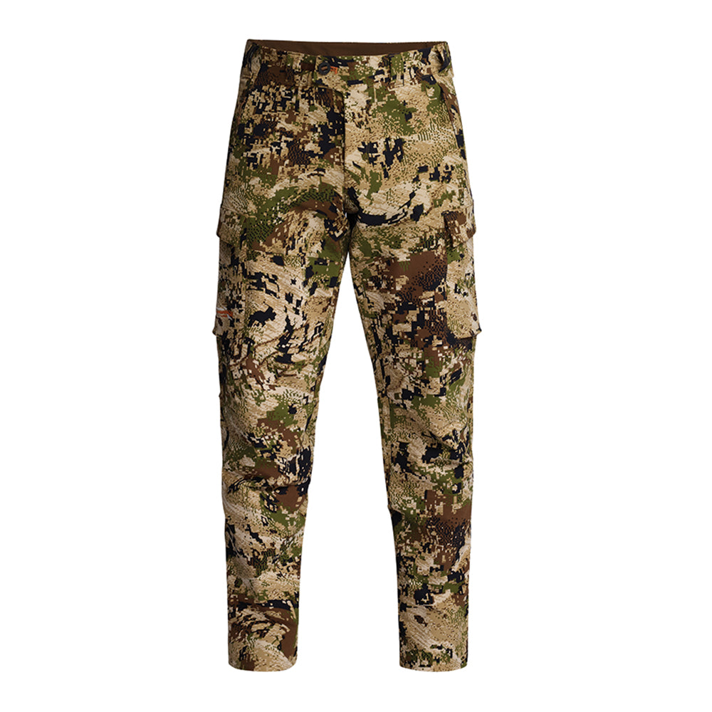 A pair of Sitka camouflage cargo pants in a digital bark pattern with shades of tan, brown, green, and black, shown against a plain white background.